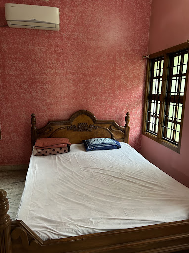 Air-conditioned dorm room with modern amenities, comfortable beds, and charging stations